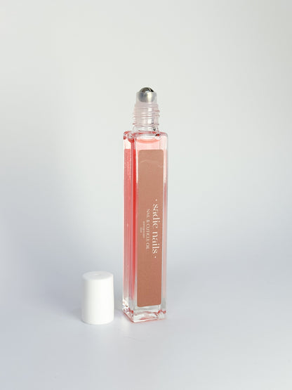 bottle of pomegranate cuticle oil standing up